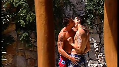 Handsome studs in Hawaiian shorts fuck each other at the beach
